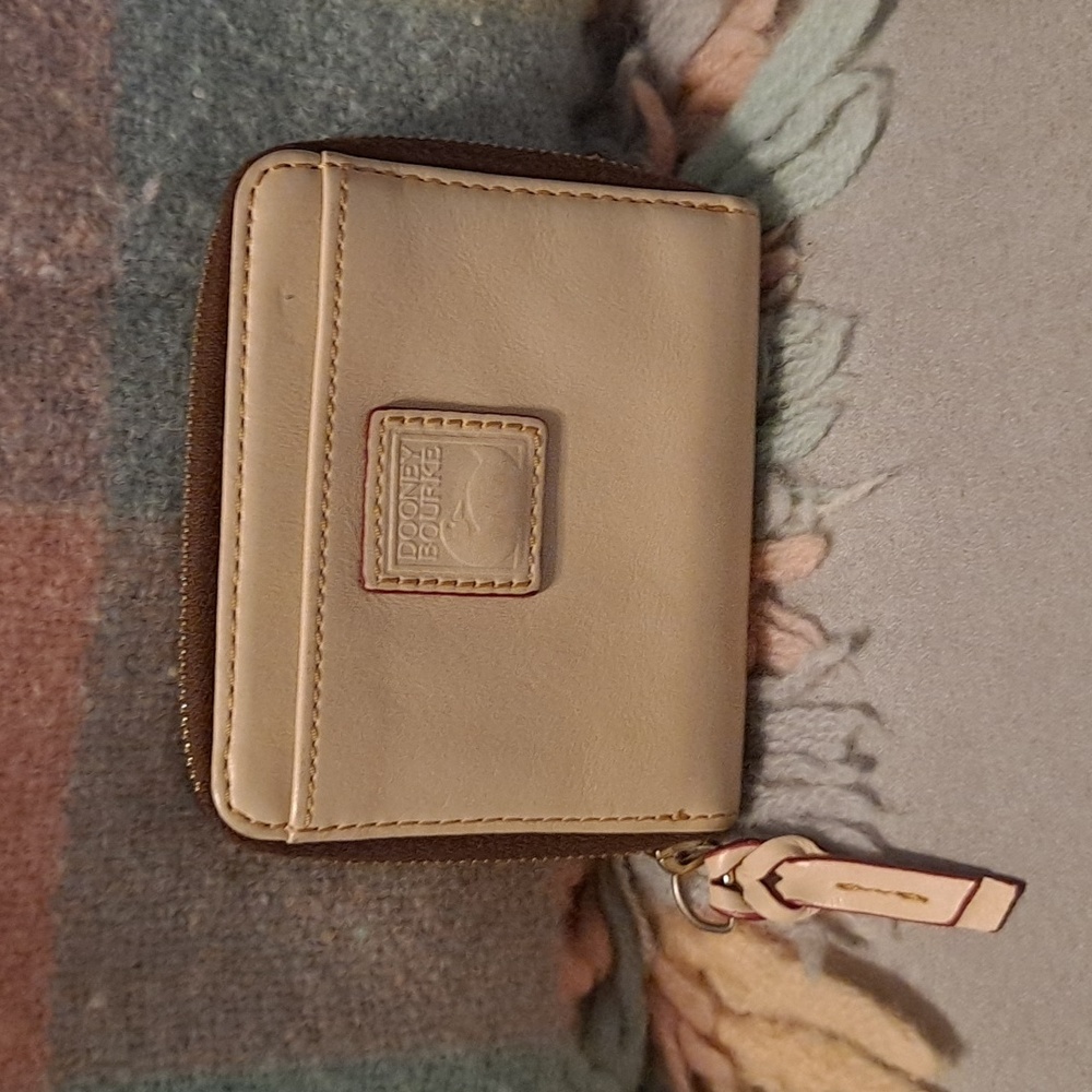 Dooney and Bourke small wallet in I believe Bone Florentine leather.